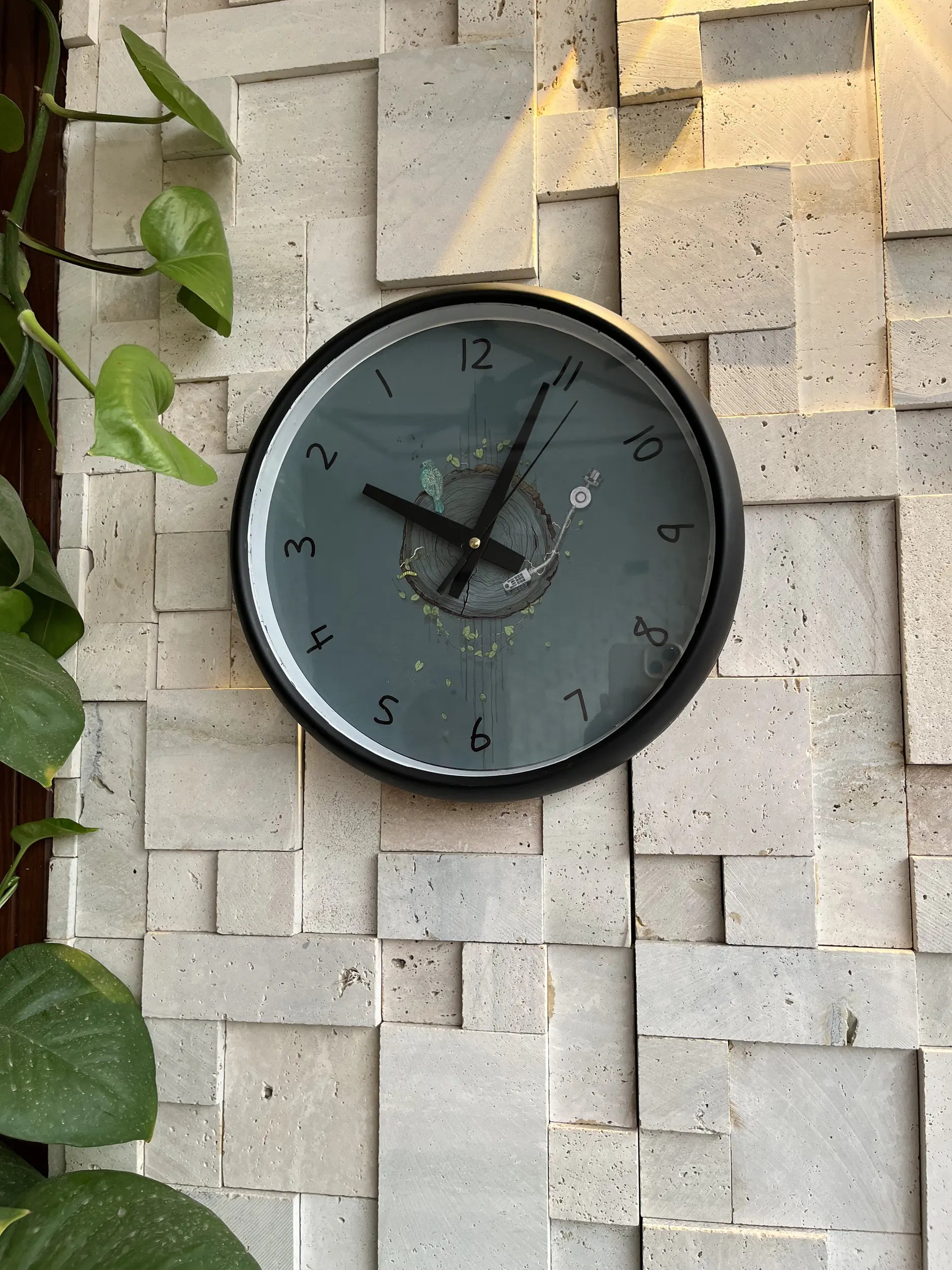 Nature's Groove reverse clock close up showing earthy botanical dial design