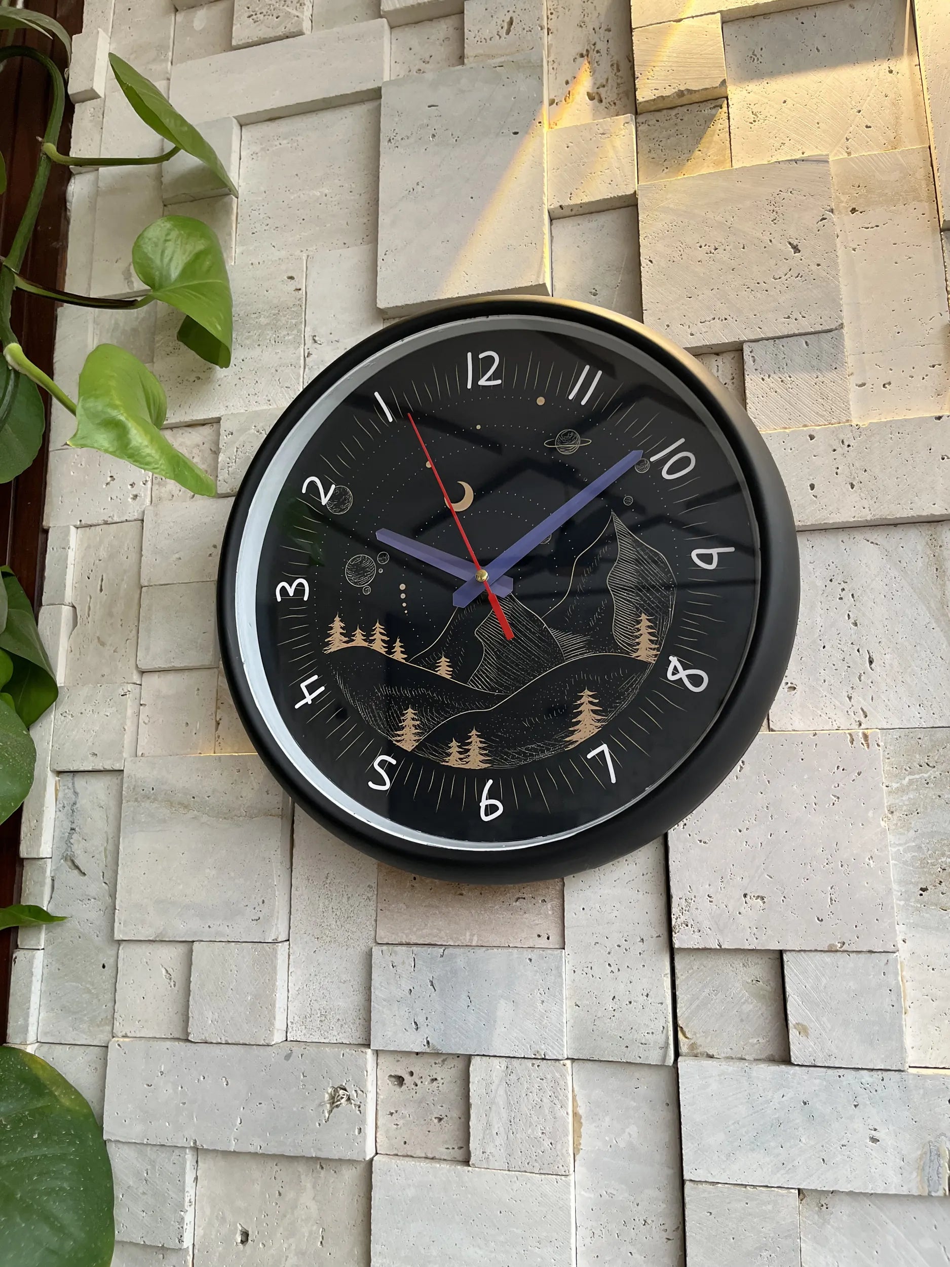 Cosmic Orbit reverse wall clock mounted in home setting Pakistan