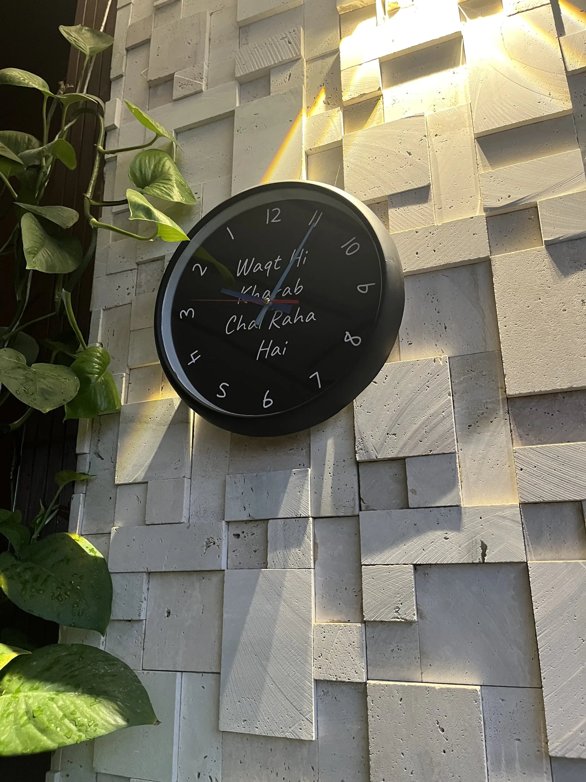 Waqt Hi Kharab reverse wall clock mounted in home interior Pakistan